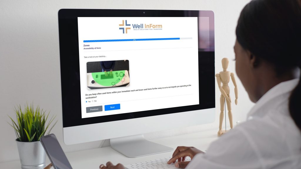 person looking at computer with well inform program on the screen